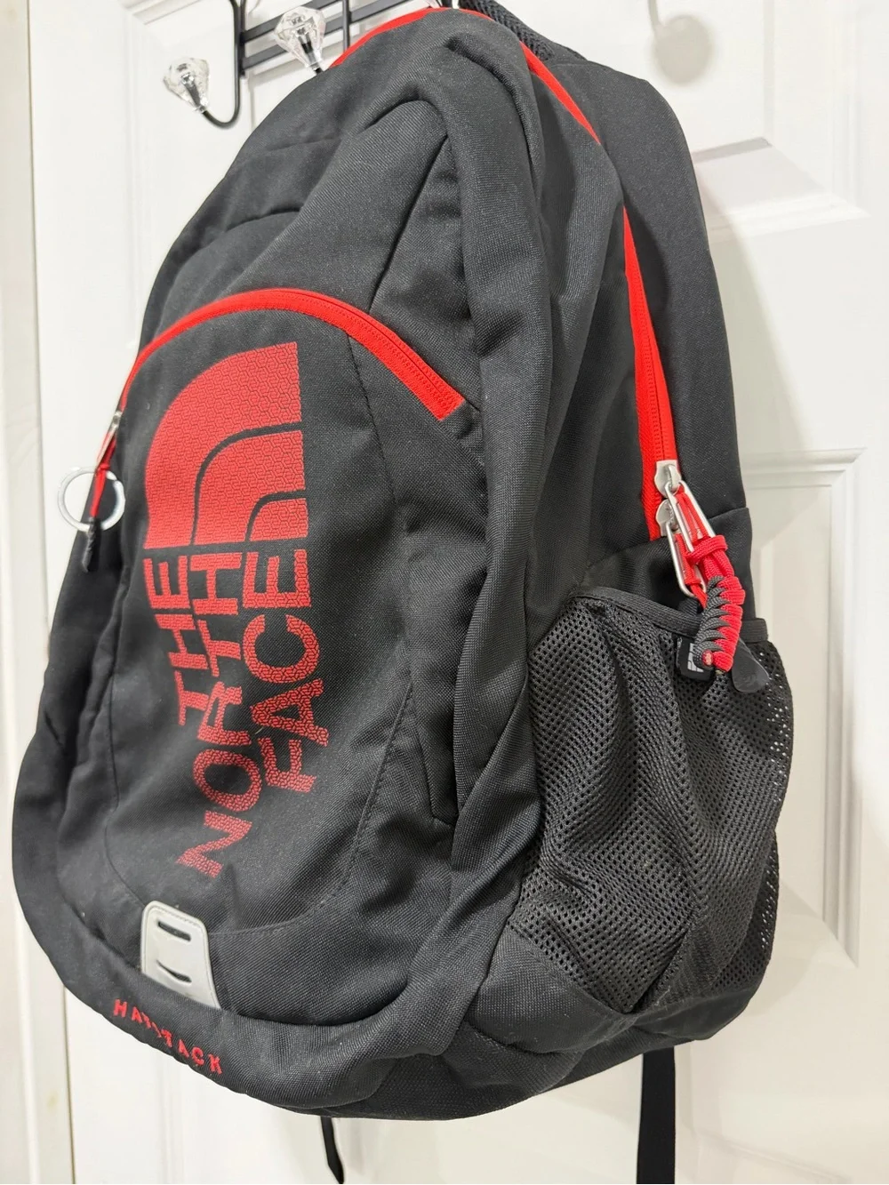 The North Face Haystack Backpack Vertical logo Black and Red
